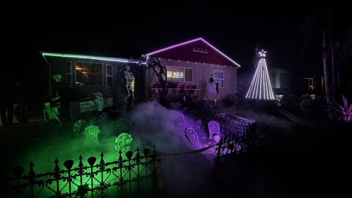 Green light washing over the graveyard and fence