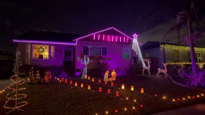 Purple roof lights and a white pixel tree over the path lights